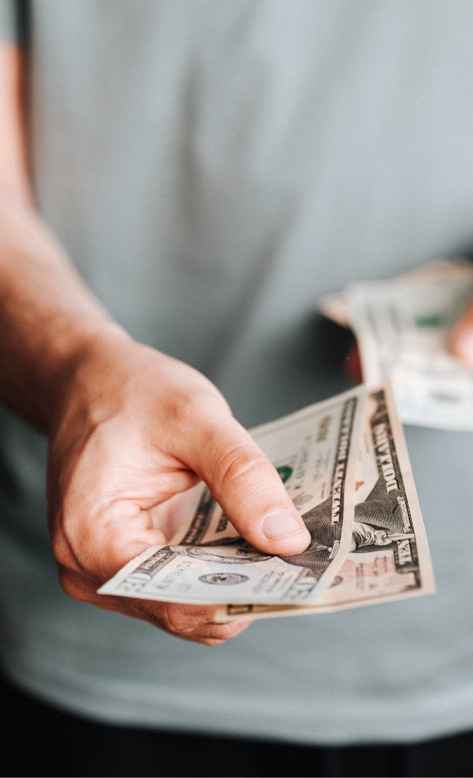 veteran with money in hand