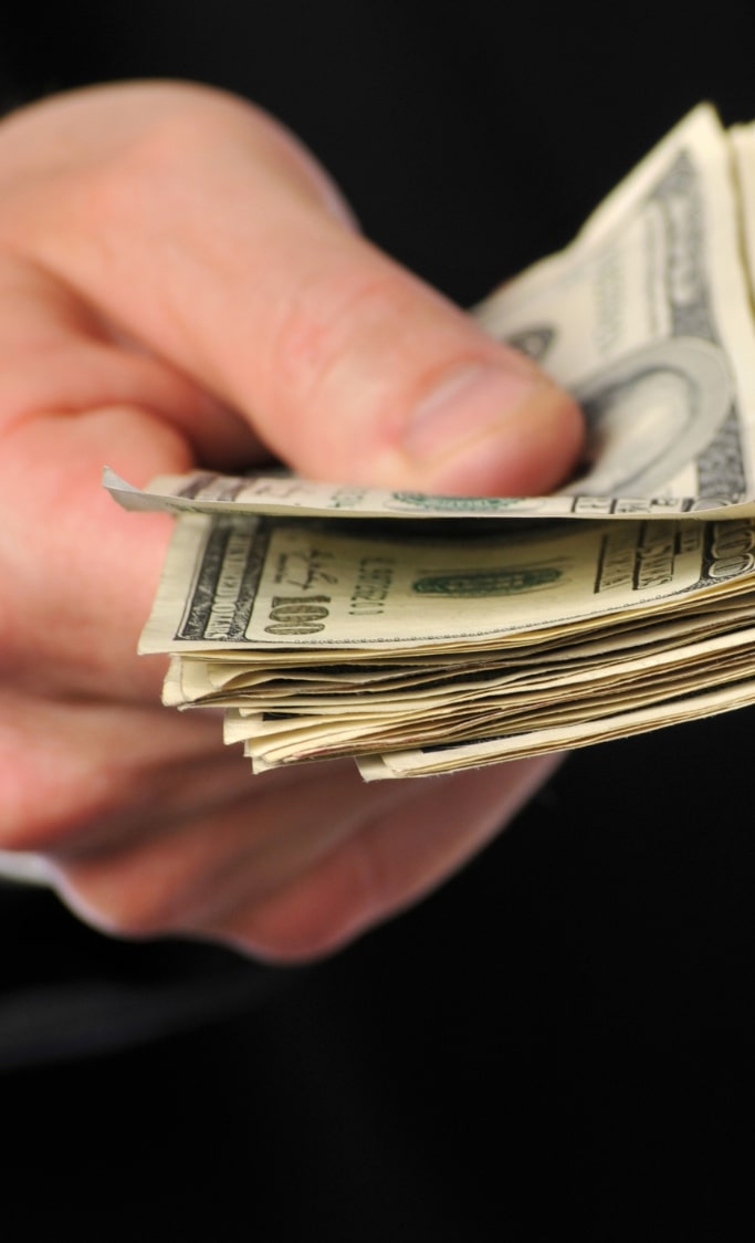 handing money to veteran